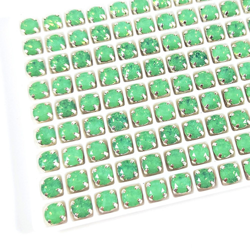 6mm chaton stone in silver claw setting, Pacific Opal. 6mm chaton stone in silver claw setting, Pacific Opal.