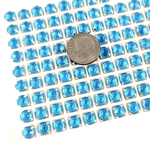 6mm chaton stone in silver claw setting. Aqua Ultra AB.