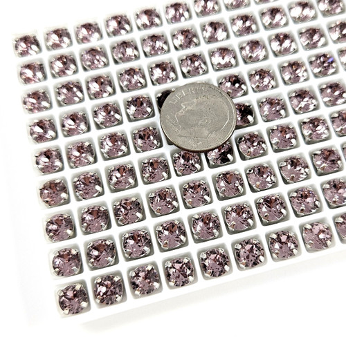 6mm chaton crystal in silver claw setting. Lt Amethyst. 6mm chaton crystal in silver claw setting. Lt Amethyst.