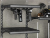 Black gun rack holding two handguns inside a Browning safe.