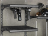 Black gun rack holding two handguns inside a Browning safe.