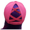 Pink baseball cap with crisscross straps and purple hair peeking through