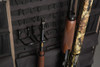 Black fabric organizer with two gun barrels, one wood, one camo.