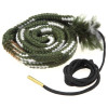 Green and white coiled gun bore cleaner with black cord and brass tip.