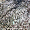 Close-up of Wildgrass Camo palm leaf mat with green and brown tones.