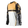 Long-sleeve Browning shooting shirt in black, gold, and white; polyester material; angled view.