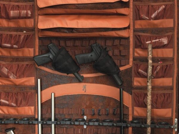 Browning safe interior with two handguns in holsters and storage pockets.