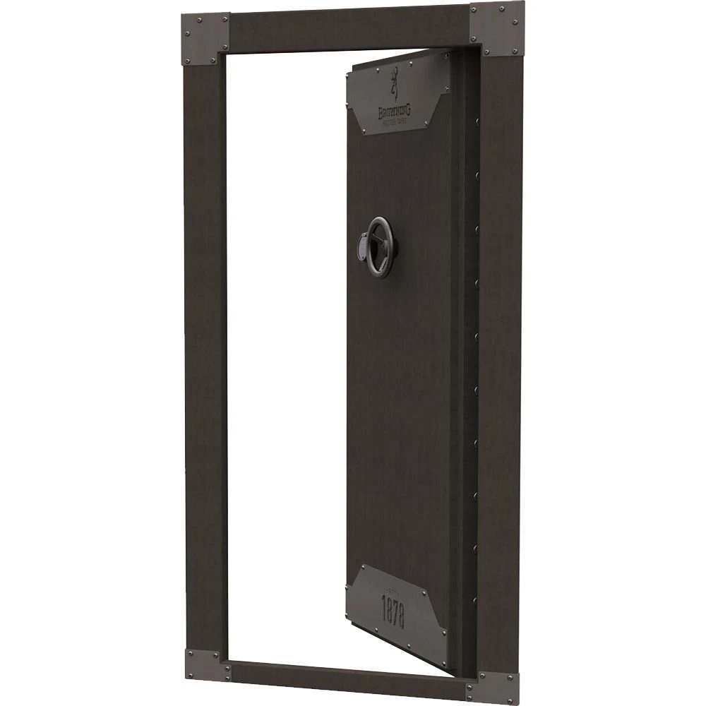 Dark wood Browning vault door, open inward, with silver handle and emblem.