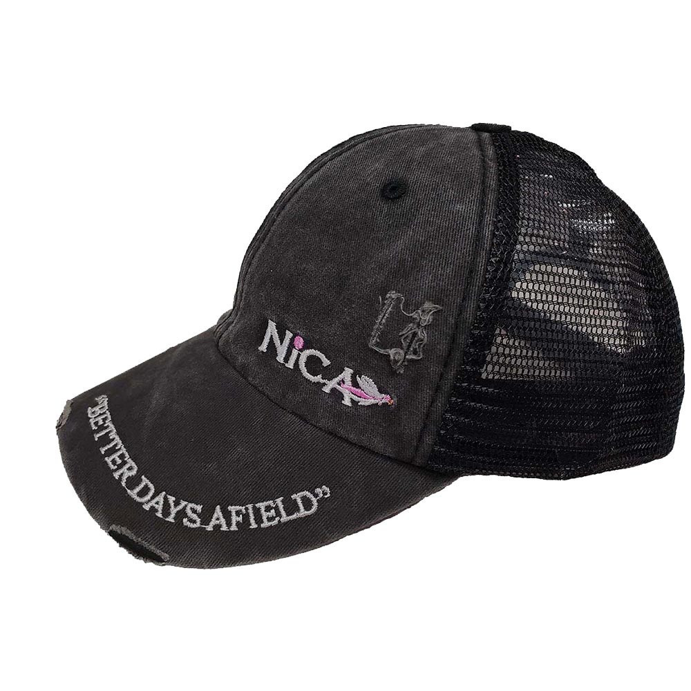 Black Nica trucker hat with distressed fabric, mesh back, and embroidered logo and text.