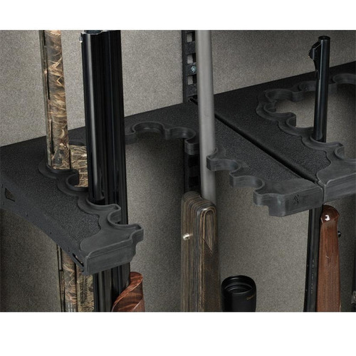 Black Browning barrel rack holding multiple long guns inside a gun safe.