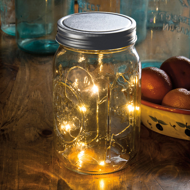 Large mouth mason jar with lights.  Has timer, needs batteries to light up