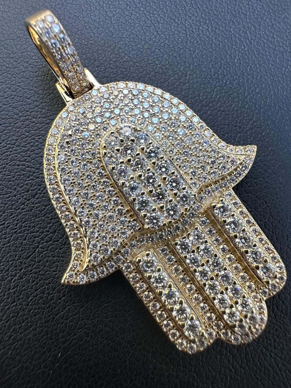 https://cdn11.bigcommerce.com/s-s8inshvd4z/images/stencil/original/products/6370/100434/hip-hop-solid-10k-yellow-or-white-gold-hamsa-hand-iced-3ct-moissanite-pendant-necklace__05516.1697424174.jpg?c=2