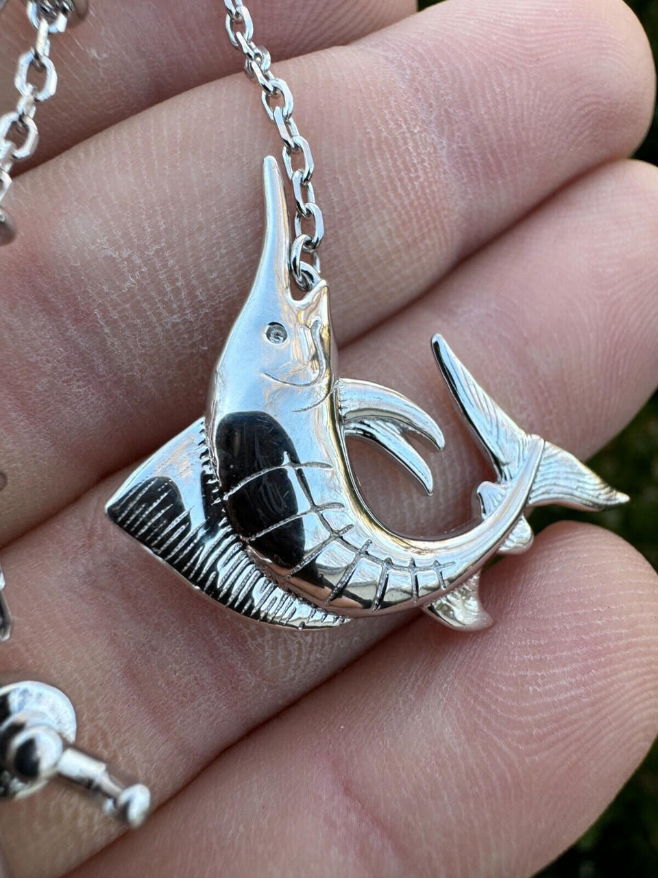 https://cdn11.bigcommerce.com/s-s8inshvd4z/images/stencil/original/products/6515/106510/real-large-mens-925-silver-gold-fishing-pendant-rod-and-marlin-fish-necklace__17797.1707554007.jpg?c=2