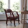Oxblood Vinyl Luxurious Conference Chair with Accent Nail Trim and Casters