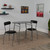Sutton 3 Piece Space-Saver Bistro Set with Black Glass Top Table and Black Vinyl Padded Chairs - Lifestyle Image - view-0