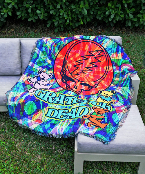 Triple woven tapestry throw blanket with licensed Grateful Dead design.