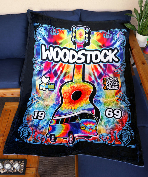 Plush flannel fleece throw blanket with licensed Woodstock design.