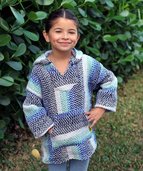 Young boy wearing the Baja Kids Mexican hoodie pistachio