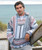 man wearing the Baja Joe Mexican hoodie pastel terracotta hoodie