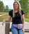 Girl wearing a Fanny pack made from 100% recycled fibers.