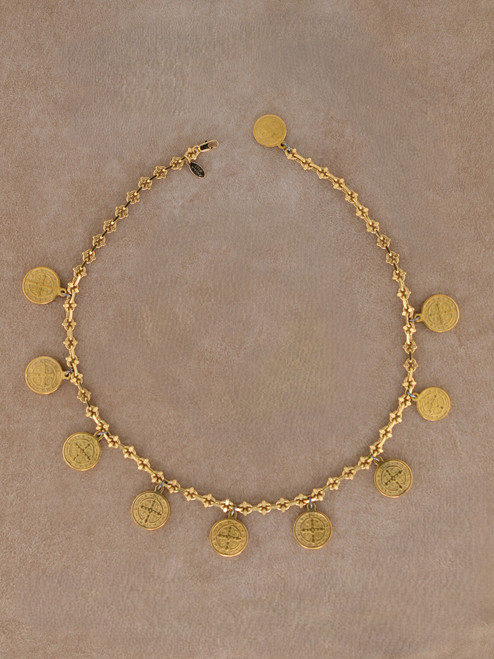 Gold San Benito medallion collar necklace with multiple round protection medallions on a textured gold chain