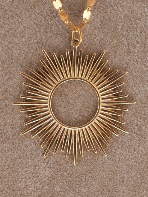 Solara Bronze Pendant featuring an open sunburst design