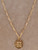 San Benito Medallion Necklace featuring a Saint Benedict-inspired gold medallion on the Mira Gold elongated paperclip chain in 14-karat gold overlay.