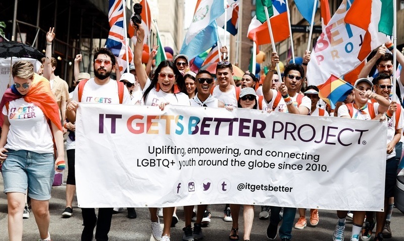 A group of advocates for the It Gets Better project proudly supporting the cause that empowers youth in the LGBTQ+ community.