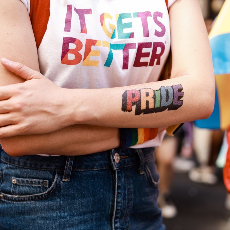 LGBTQ+ supporter shows pride through It Gets Better organization.