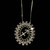 Circular necklace offered in silver and gold. The necklace displays the zodiac sign of your choice in diamonds and is surrounded by crystals.