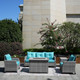 High Fire Pit Table in Gray with Cyan Cushion Covers 