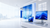 Bright Windows 11 Enterprise showroom with modern desktop and laptop computers