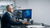 Engineering professional using dual-monitor workstation for simulation and 3D modelling