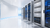 Bright Windows Server 2025 datacentre showroom with platinum server racks and Azure-blue data paths