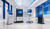 Self-service kiosk, industrial control panel, healthcare workstation and digital-signage endpoint displayed in a bright Windows IoT enterprise gallery.