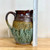 Handmade Stoneware Carved Leaf 7.75" Pitcher in Green and Plum Brown