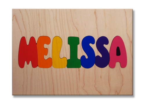 Wooden One Name Puzzle with all capital letters on a natural background.
