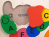 Alphabet ABC Wooden Puzzle closeup detail of Capital and lowercase "A" and "apple".