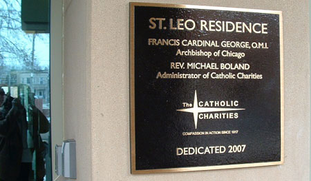 Exterior Cast Bronze Plaque with leather - pebbled background, raised logo and copy with flat, standard border.