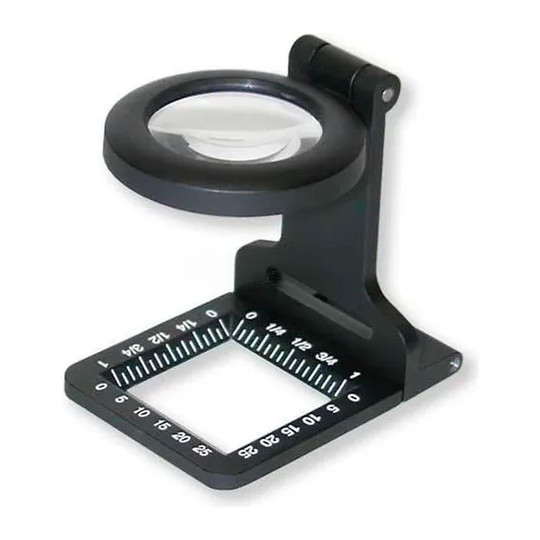 Black fold-out linen tester magnifier with glass lens and measurement markings
