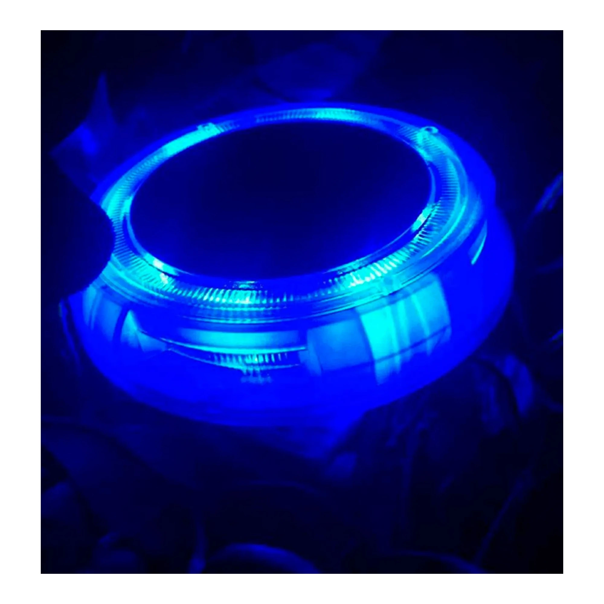 Four solar dusk-to-dawn LED garden lights with white, purple, blue, and green illumination