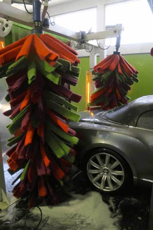 An automobile getting waxed
