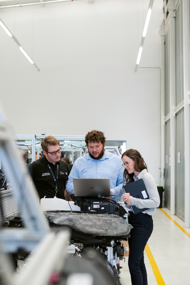 Team of fleet wash experts reviewing designs