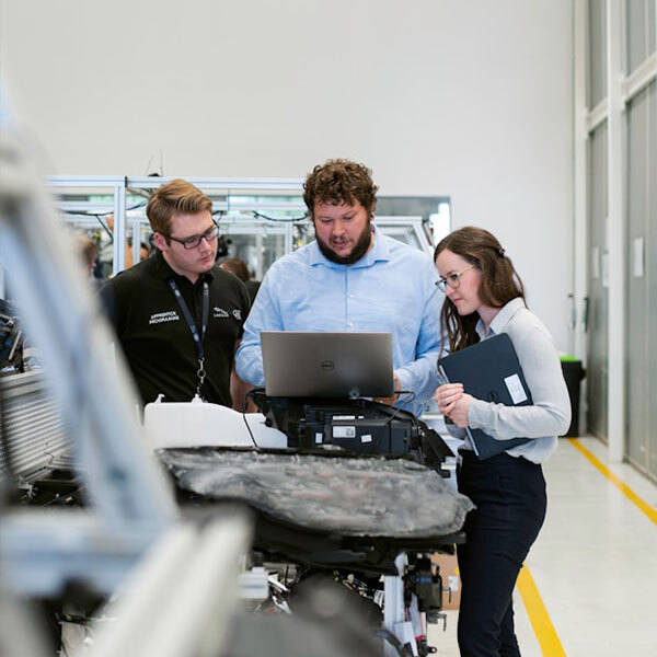 Team of fleet wash experts reviewing designs