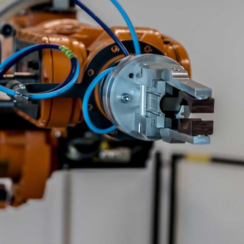 Miniature inductive sensors figure out jaw status for high accuracy robot grippers