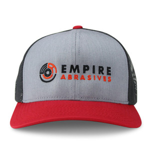 Empire Abrasives grey front, black mesh back, red brim snapback trucker hat with embroidered flap disc logo.