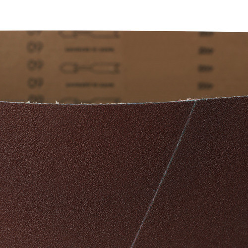 Close-up of a 52x75 aluminum oxide wide sanding belt, showing its brown abrasive surface.
