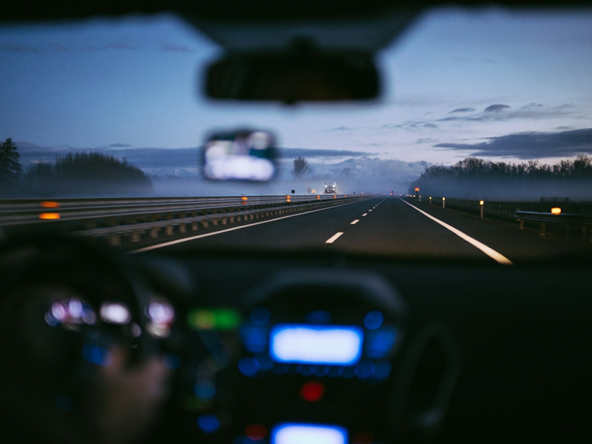 A car using cruise control on a highway