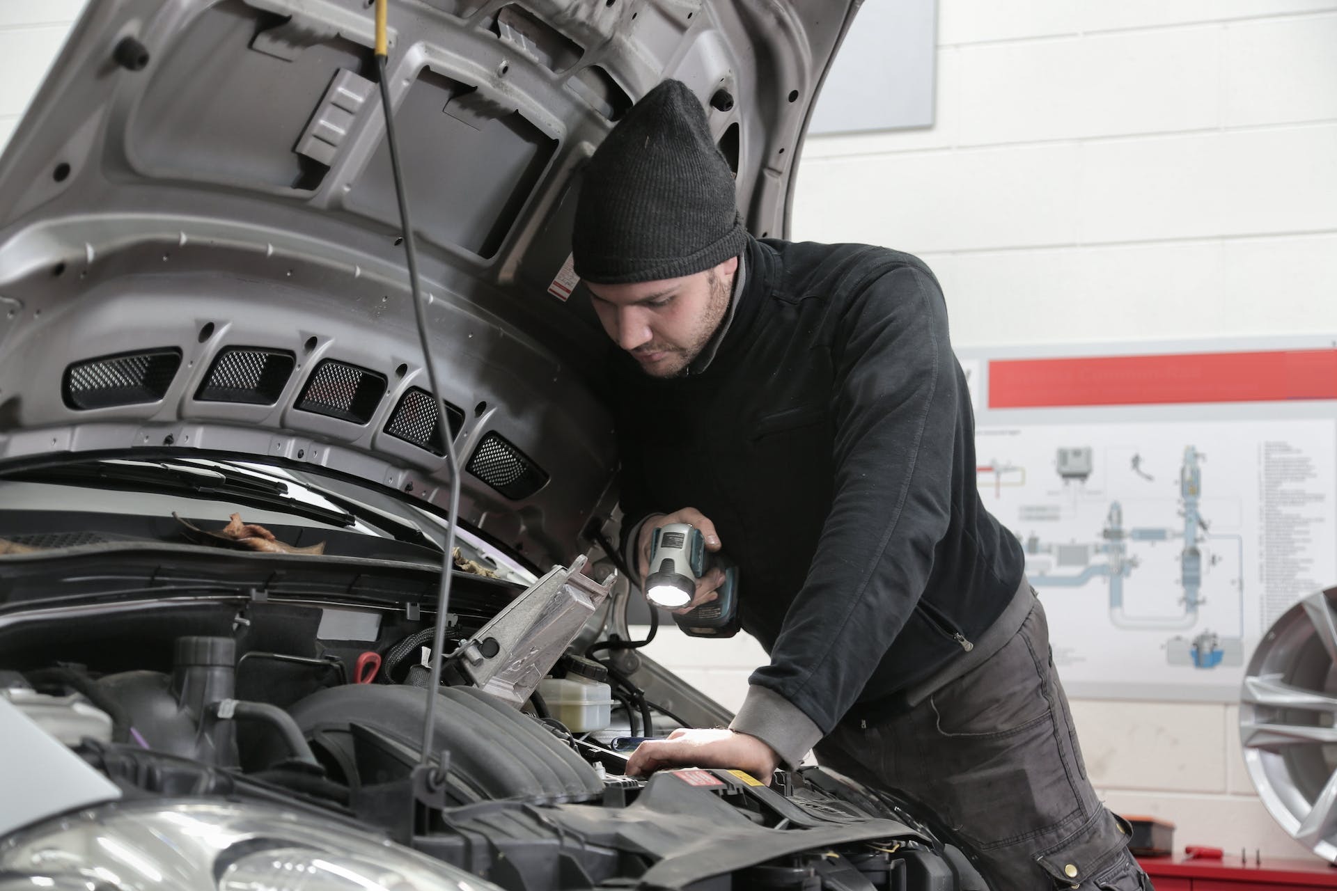 Man checking fuel filter