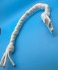 Image shows a very small hand braided organic cotton dog tug toy.  It is white and is displayed against a blue background.  Plastic free natural dog toys by Purrfectplay.  Handmade in the USA.  